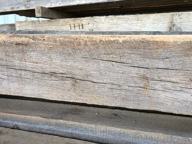 reclaimed antique rough sawn barn beams close up