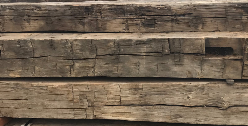 reclaimed antique hand-hewn barn beams close up
